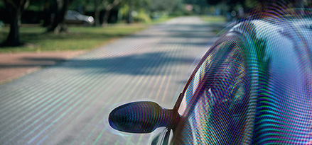 The outside of a car with some kind of forcefield